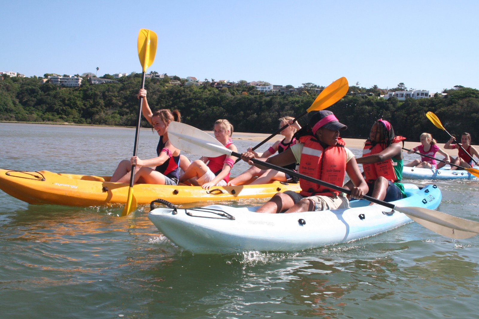 Learners paddling canoes on the Cefani lagoon