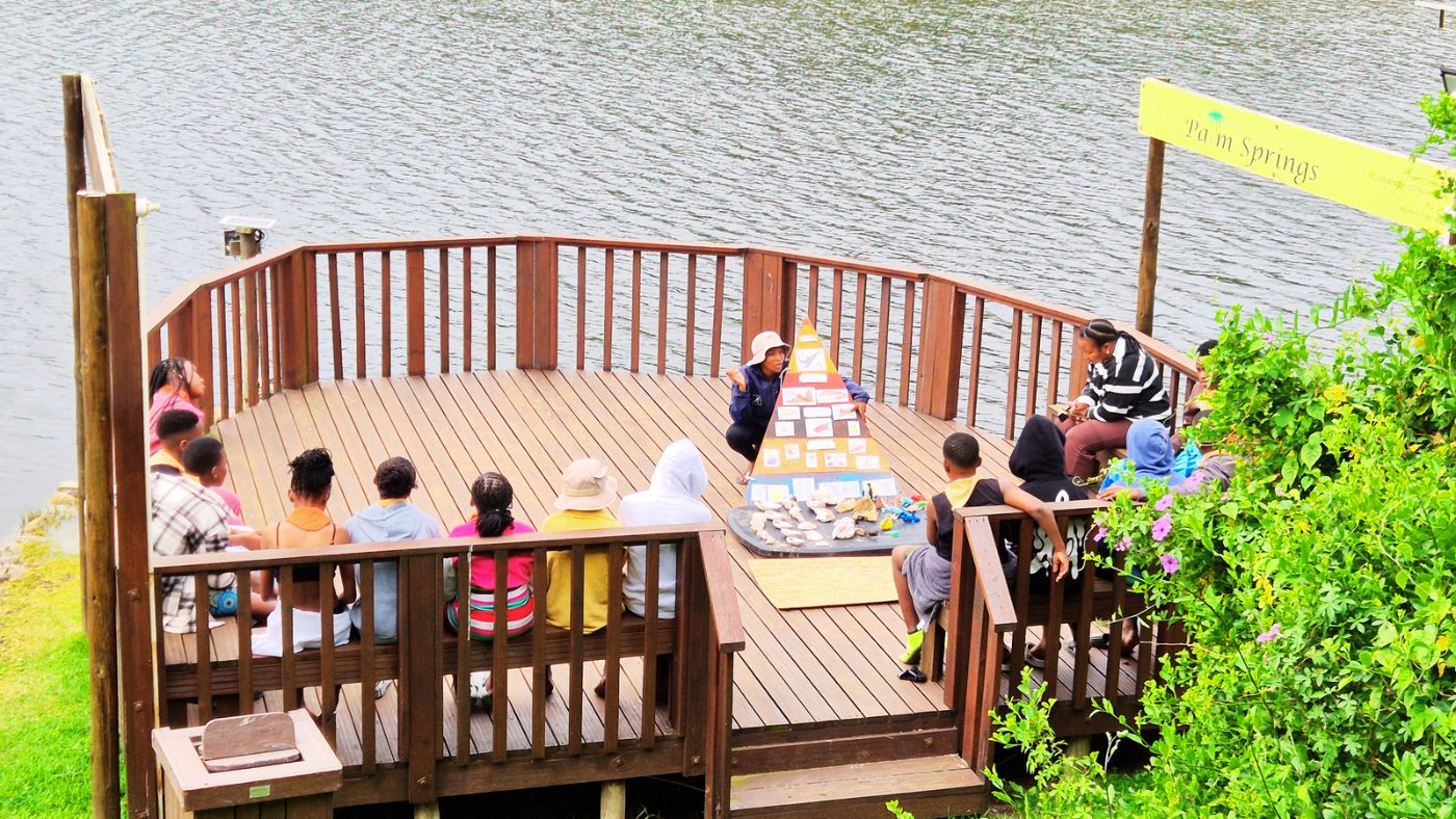 Environmental education lesson on the riverside deck at Palm Springs Resort